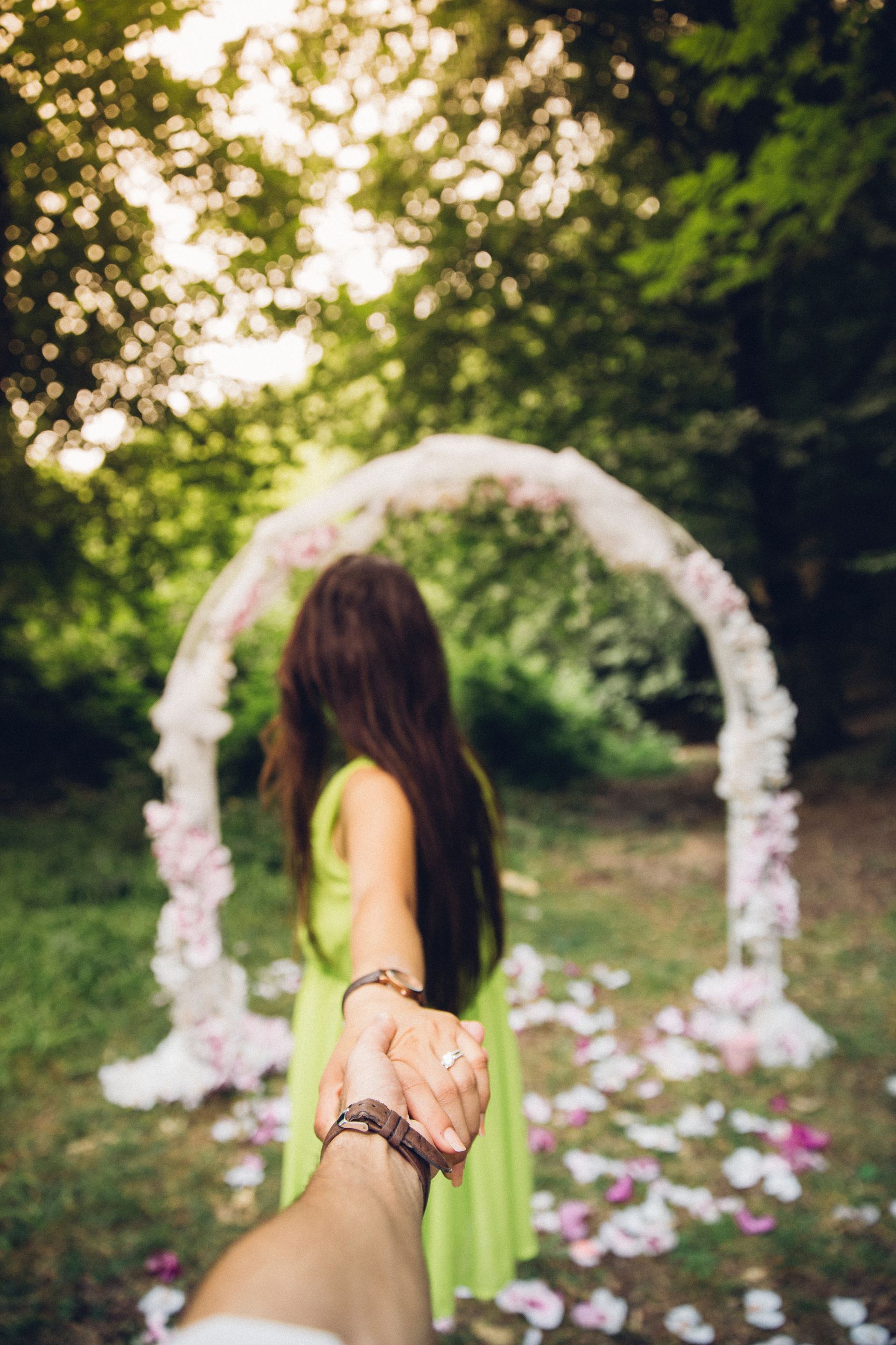 a person standing in front of a forest