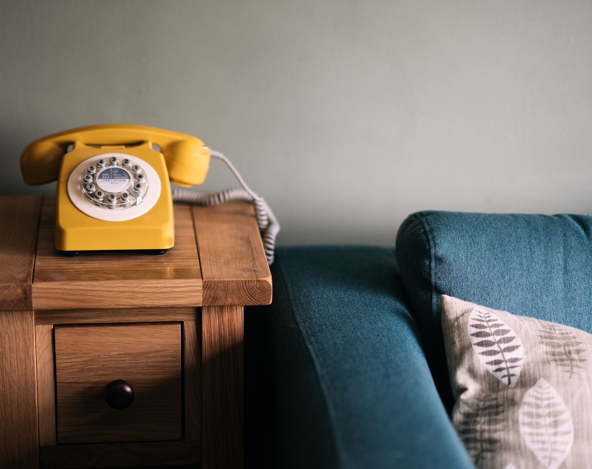 telephone next to a sofa