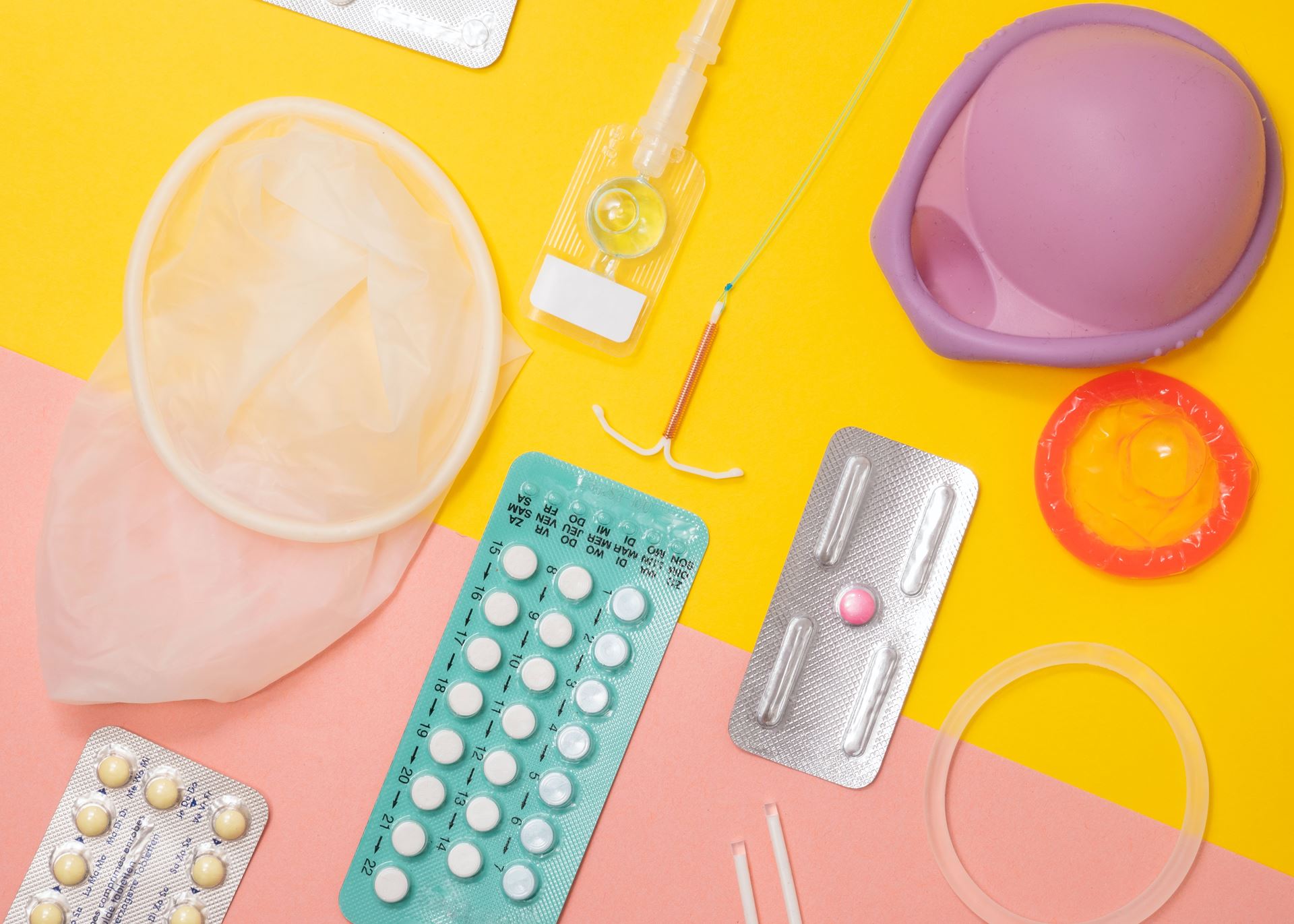 a selection of birth control items on a yellow background